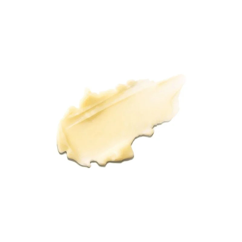 Gros plan sur la texture translucide jaune du baume solaire SPF50+ MÊME étalé sur surface blanche, m