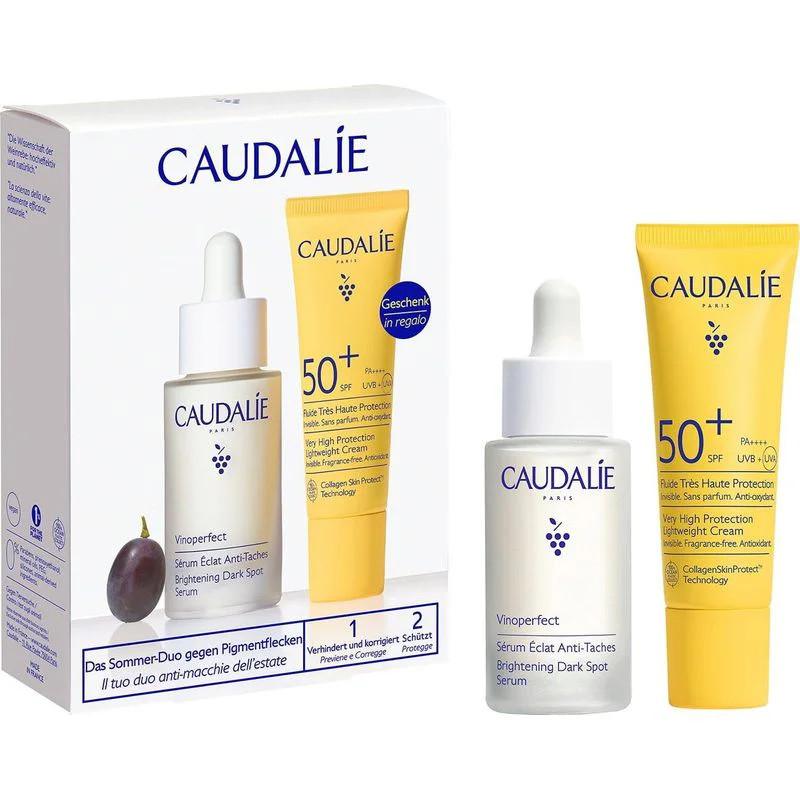 Caudalie 1112431 coffret cadeau ouvert : flacon sérum pipette, tube jaune SPF50+, boîte blanche, rai